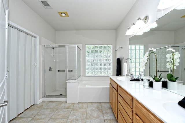 212 Yukon Ter, Georgetown, TX 78633 - full bath featuring a stall shower, plenty of natural light, and a garden tub