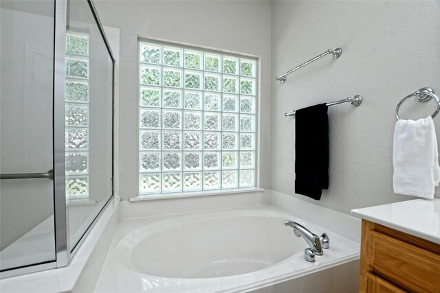 212 Yukon Ter, Georgetown, TX 78633 - full bath with plenty of natural light, a bath, and vanity
