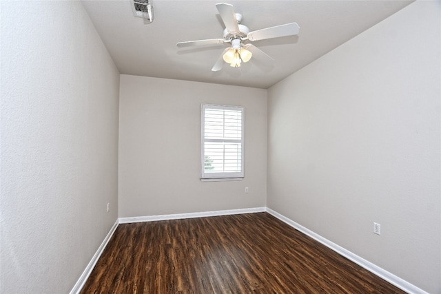 212 Yukon Ter, Georgetown, TX 78633 - unfurnished room with baseboards, dark wood finished floors, and ceiling fan