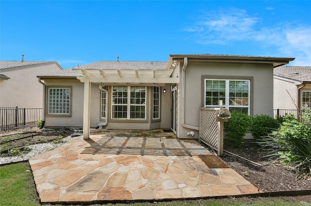 212 Yukon Ter, Georgetown, TX 78633 - back of house featuring fence, a pergola, a patio area, and stucco siding