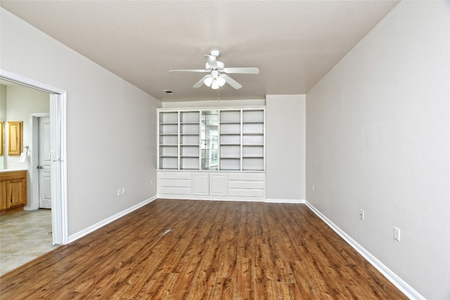 212 Yukon Ter, Georgetown, TX 78633 - unfurnished room featuring a ceiling fan, baseboards, and wood finished floors