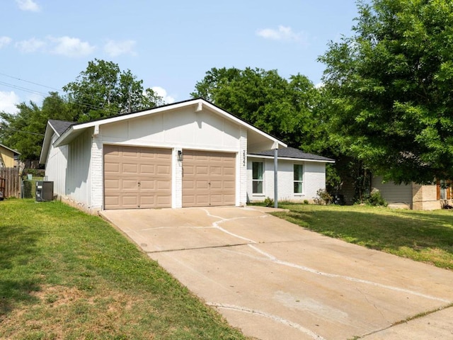 2522 Chaparral Trl, Austin, TX 78744 - view of front of house featuring driveway, a garage, a front yard, and brick siding