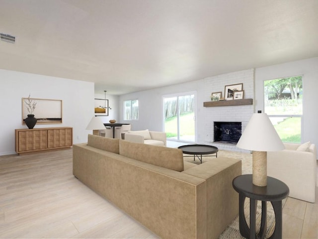 2522 Chaparral Trl, Austin, TX 78744 - living room with a brick fireplace and light wood-style floors