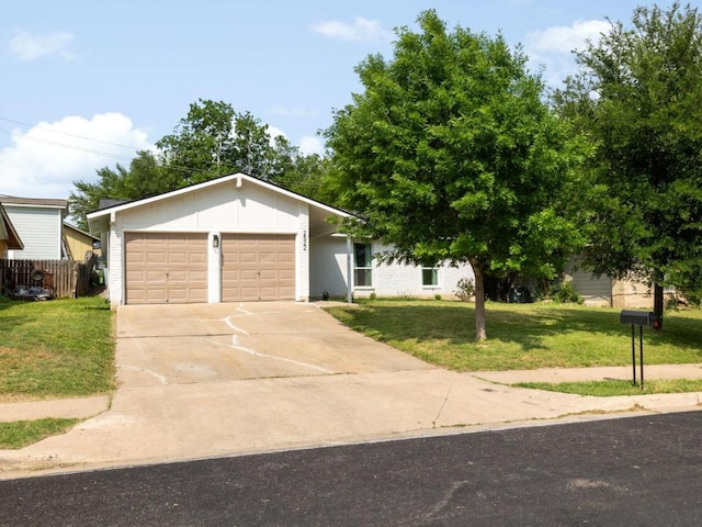 2522 Chaparral Trl, Austin, TX 78744 - view of front facade with an attached garage, concrete driveway, and brick siding