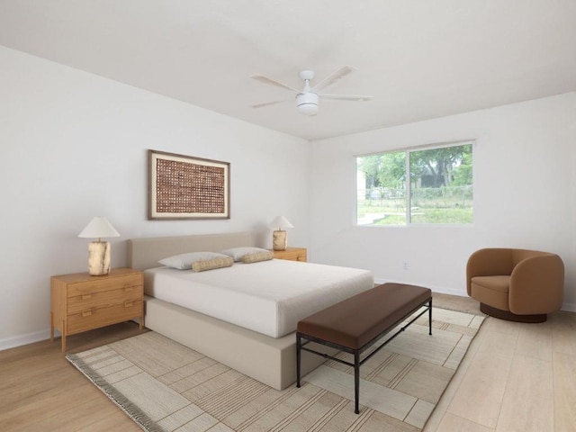 bedroom featuring light wood-style floors, baseboards, and a ceiling fan