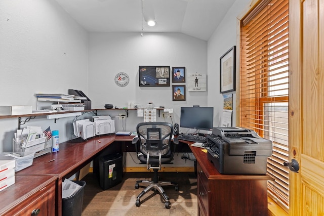 office area with vaulted ceiling