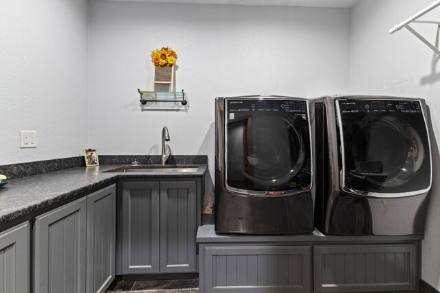 laundry area featuring cabinet space and washer and dryer
