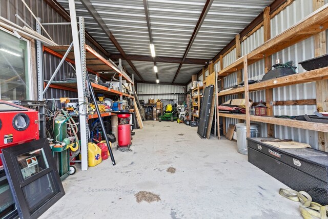 garage featuring metal wall and a workshop area
