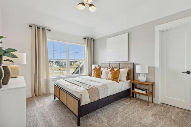 bedroom featuring carpet floors and baseboards