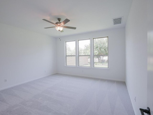 1709 Cayuga St, Leander, TX 78641 - spare room featuring light colored carpet, ceiling fan, and baseboards