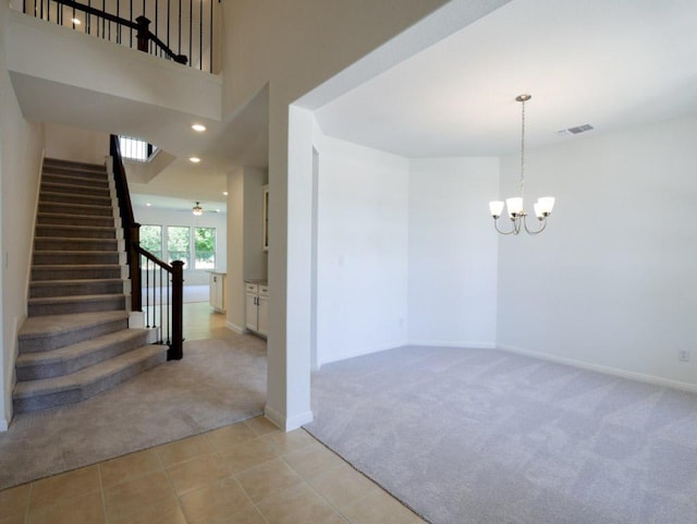1709 Cayuga St, Leander, TX 78641 - unfurnished room with light colored carpet, a chandelier, stairway, and baseboards