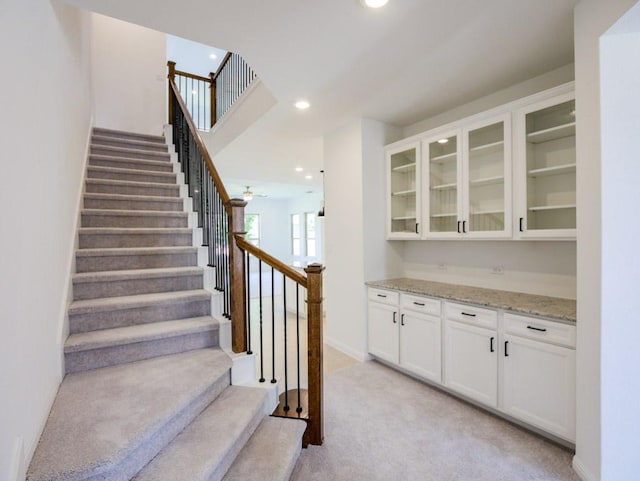 1709 Cayuga St, Leander, TX 78641 - bar with stairway, light colored carpet, recessed lighting, baseboards, and a ceiling fan