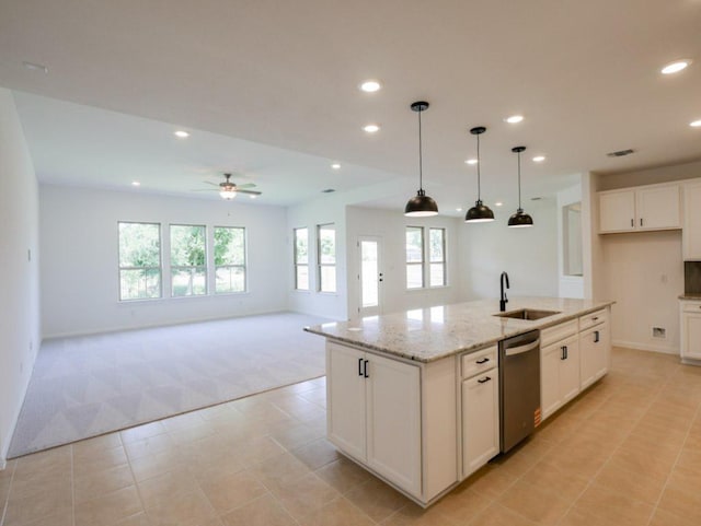 1709 Cayuga St, Leander, TX 78641 - kitchen featuring light carpet, stainless steel dishwasher, a sink, recessed lighting, and white cabinetry