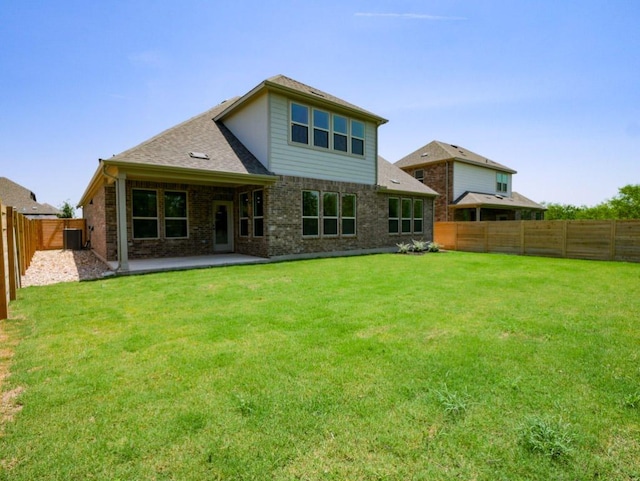 1709 Cayuga St, Leander, TX 78641 - rear view of property with brick siding, central air condition unit, and a patio area