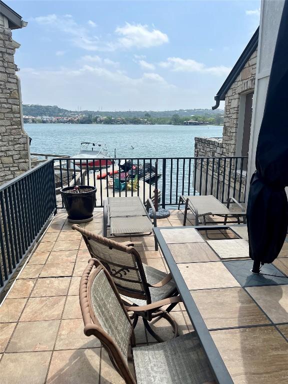 103 Island Dr Unit 8, Horseshoe Bay, TX 78657 - view of patio / terrace featuring a water view and a balcony