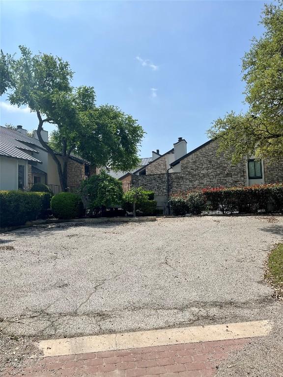 103 Island Dr Unit 8, Horseshoe Bay, TX 78657 - view of side of property featuring stone siding