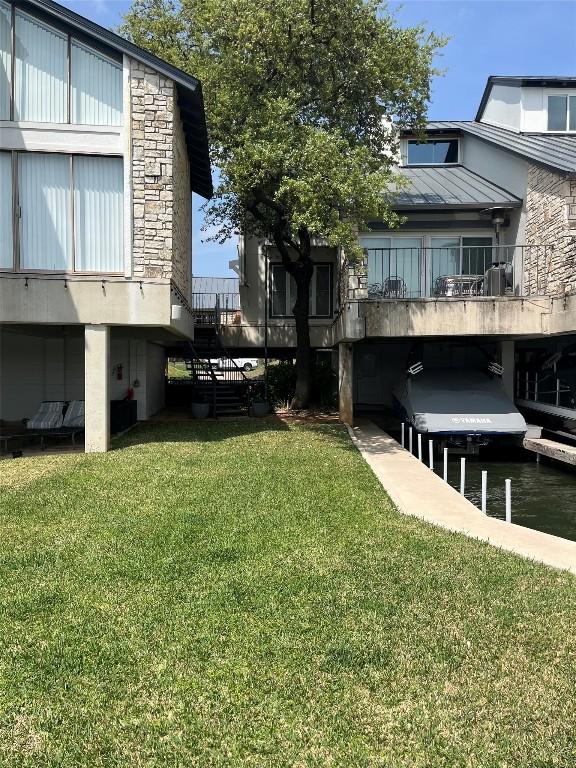 103 Island Dr Unit 8, Horseshoe Bay, TX 78657 - view of grassy yard featuring stairs and a water view