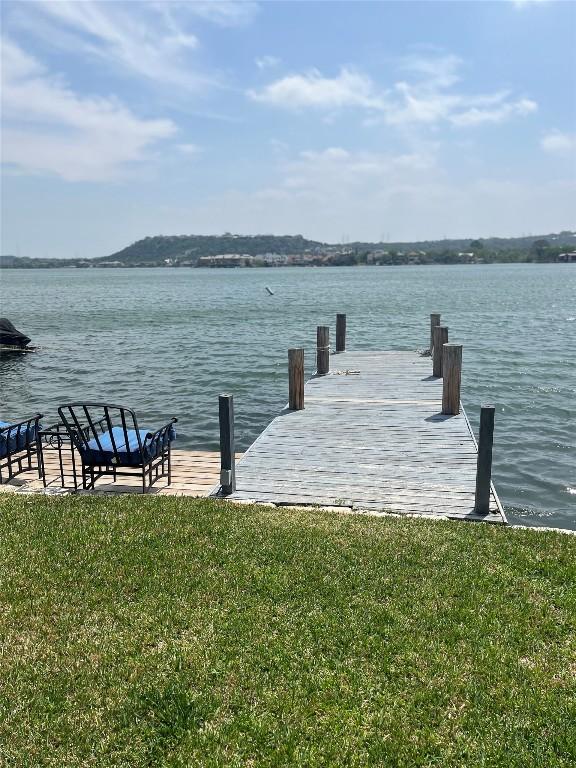 103 Island Dr Unit 8, Horseshoe Bay, TX 78657 - dock with a water view and a lawn