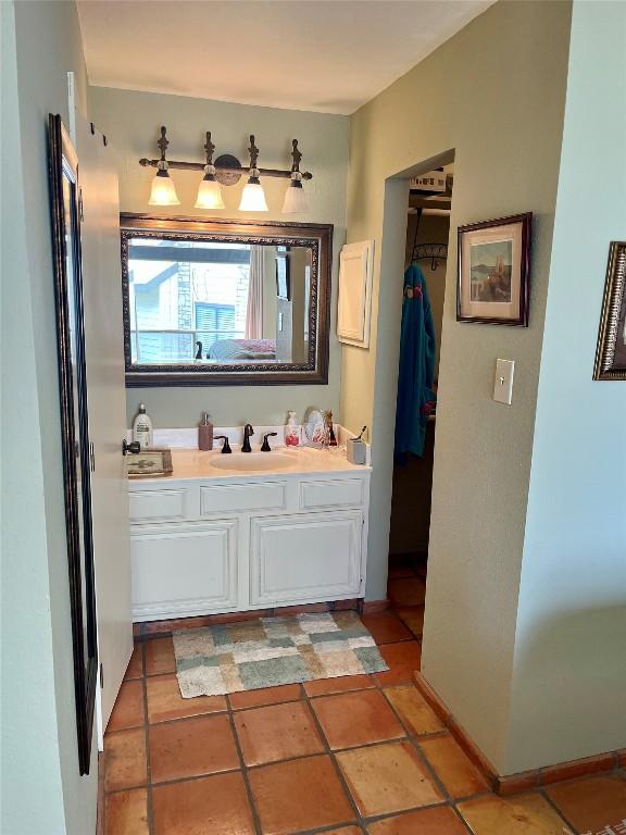 103 Island Dr Unit 8, Horseshoe Bay, TX 78657 - bathroom featuring vanity and baseboards