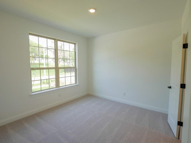 2916 Carrizo Ter, Leander, TX 78641 - unfurnished room featuring baseboards, healthy amount of natural light, light colored carpet, and recessed lighting