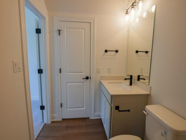 2916 Carrizo Ter, Leander, TX 78641 - bathroom featuring vanity, wood finished floors, and toilet