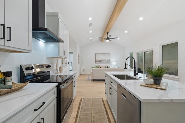 TBD Rust Ranch Rd, Blanco, TX 78606 - kitchen with appliances with stainless steel finishes, wall chimney exhaust hood, a sink, an island with sink, and light wood finished floors