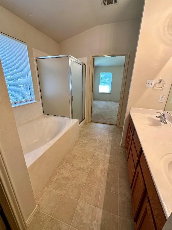 4526 Tello Path, Austin, TX 78749 - full bath with a shower stall, a garden tub, double vanity, and tile patterned flooring