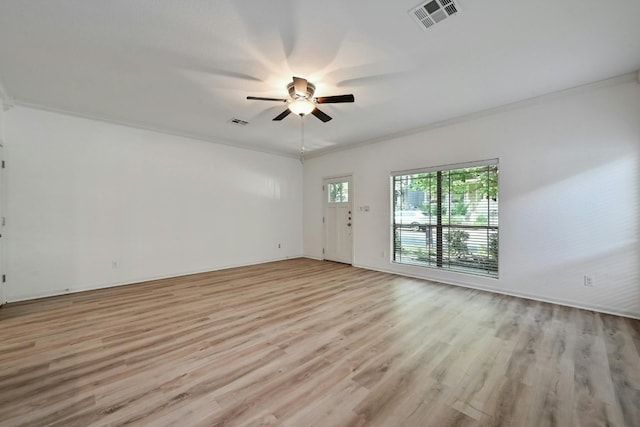 2408 Amur Dr, Austin, TX 78745 - unfurnished living room with crown molding, light wood finished floors, a ceiling fan, and baseboards