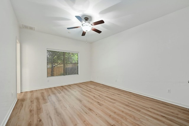 2408 Amur Dr, Austin, TX 78745 - unfurnished room featuring light wood-type flooring, a ceiling fan, and baseboards