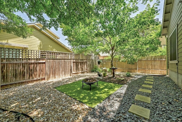 2408 Amur Dr, Austin, TX 78745 - fenced backyard featuring a fire pit