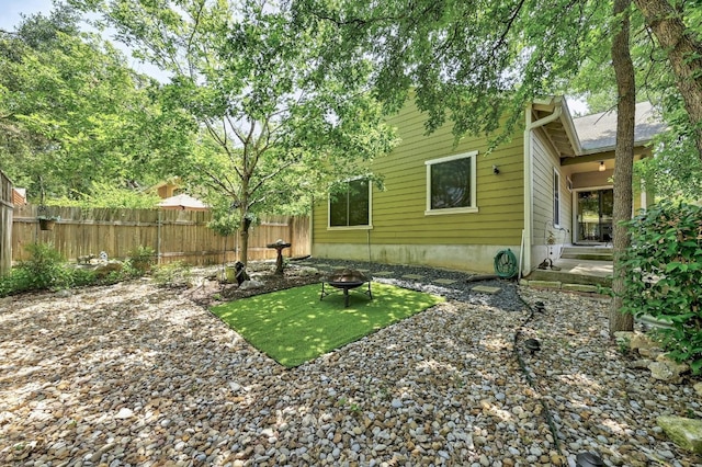 2408 Amur Dr, Austin, TX 78745 - view of yard with a fire pit
