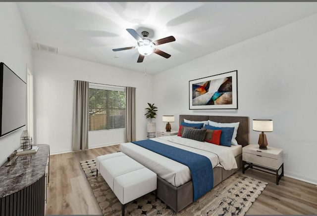 2408 Amur Dr, Austin, TX 78745 - bedroom with light wood-style floors, baseboards, and ceiling fan