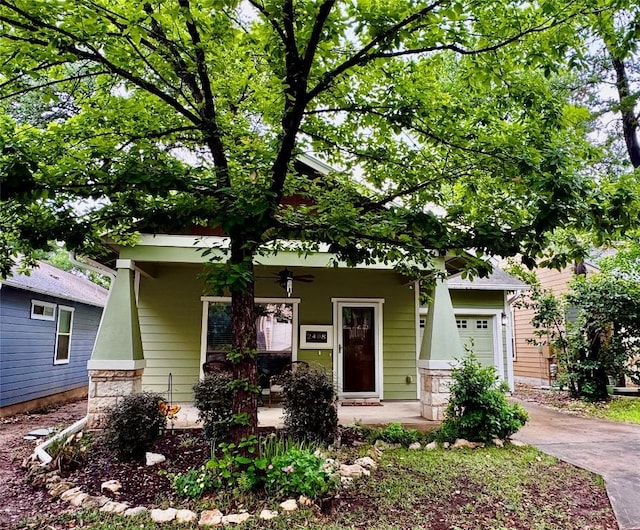 2408 Amur Dr, Austin, TX 78745 - view of front of house featuring a porch, a ceiling fan, driveway, and an attached garage