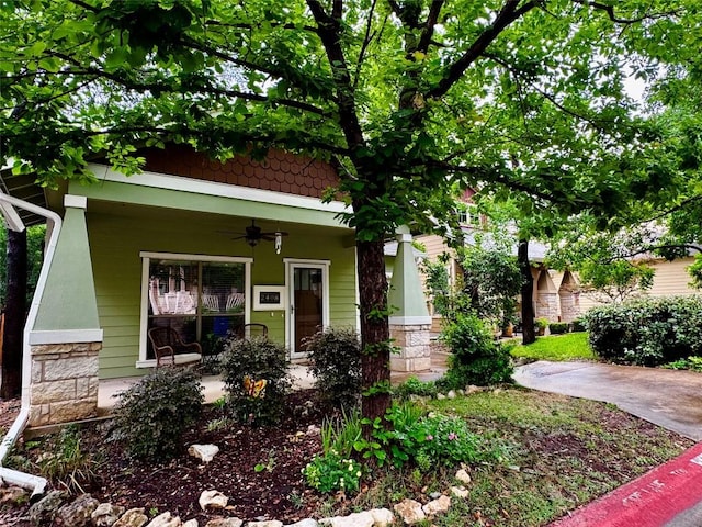 2408 Amur Dr, Austin, TX 78745 - view of front of property featuring ceiling fan, a porch, and stone siding