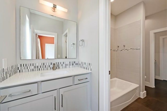 2305 E 16th St Unit A, Austin, TX 78702 - bathroom with vanity, shower / bathtub combination, and backsplash