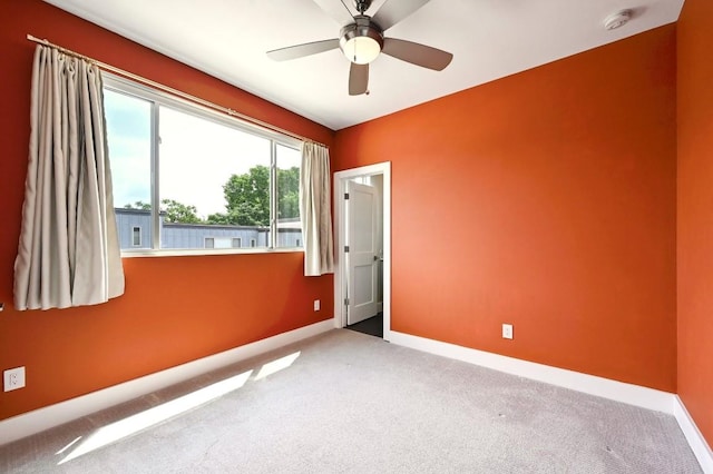 2305 E 16th St Unit A, Austin, TX 78702 - empty room with carpet floors, baseboards, a smoke detector, and ceiling fan