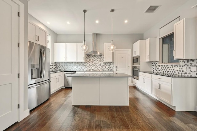 2305 E 16th St Unit A, Austin, TX 78702 - kitchen with appliances with stainless steel finishes, wall chimney exhaust hood, tasteful backsplash, a center island, and dark countertops