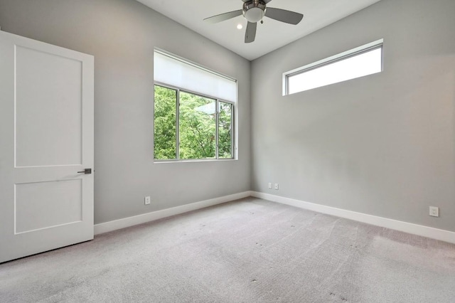 2305 E 16th St Unit A, Austin, TX 78702 - unfurnished room with baseboards, a ceiling fan, and carpet flooring
