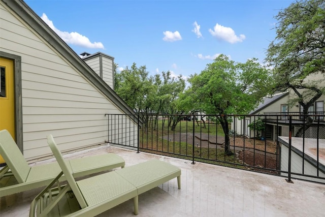 view of patio featuring a balcony