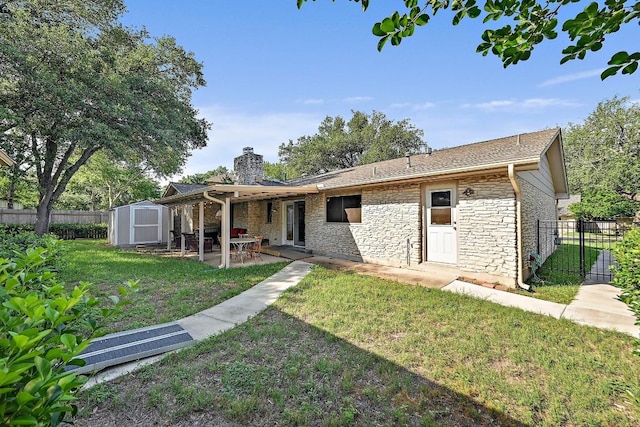 11519 Shakespearean Way, Austin, TX 78759 - rear view of house with a storage shed, a chimney, a patio area, an outdoor structure, and stone siding