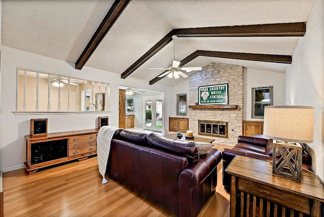 11519 Shakespearean Way, Austin, TX 78759 - living area with a ceiling fan, wood finished floors, a fireplace, and baseboards