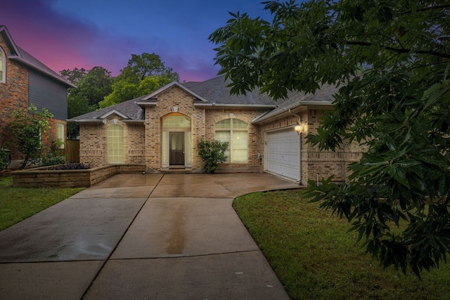 6419 Ira Ingram Dr, Austin, TX 78749 - view of front of property with driveway, brick siding, a shingled roof, and a garage