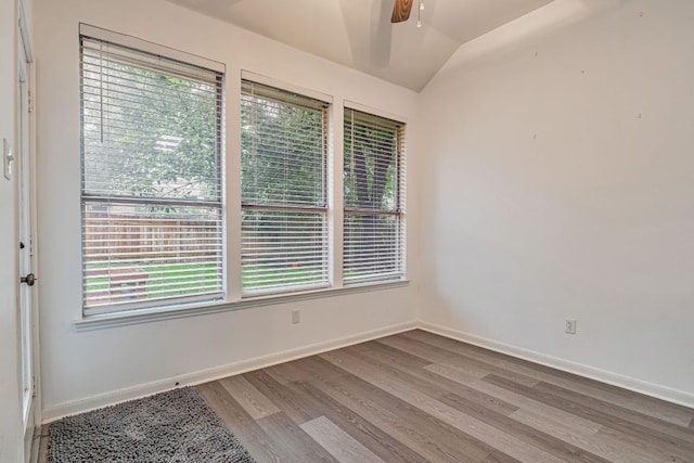6419 Ira Ingram Dr, Austin, TX 78749 - unfurnished room with a ceiling fan, wood finished floors, and lofted ceiling
