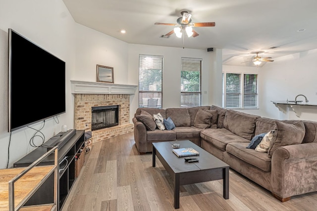 6419 Ira Ingram Dr, Austin, TX 78749 - living room featuring a ceiling fan, light wood-type flooring, a fireplace, and recessed lighting