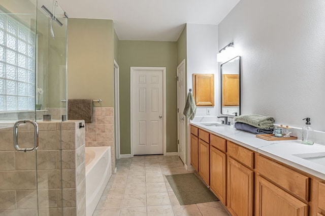 6419 Ira Ingram Dr, Austin, TX 78749 - bathroom featuring a garden tub, a stall shower, and double vanity