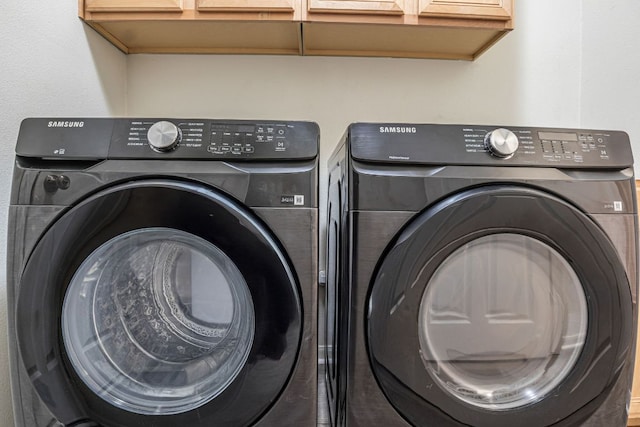 6419 Ira Ingram Dr, Austin, TX 78749 - washroom featuring cabinet space and washer and clothes dryer