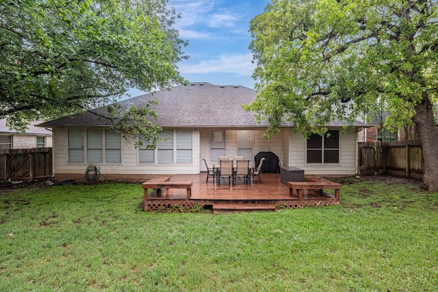 6419 Ira Ingram Dr, Austin, TX 78749 - rear view of property with a deck, a fenced backyard, outdoor dining area, and roof with shingles