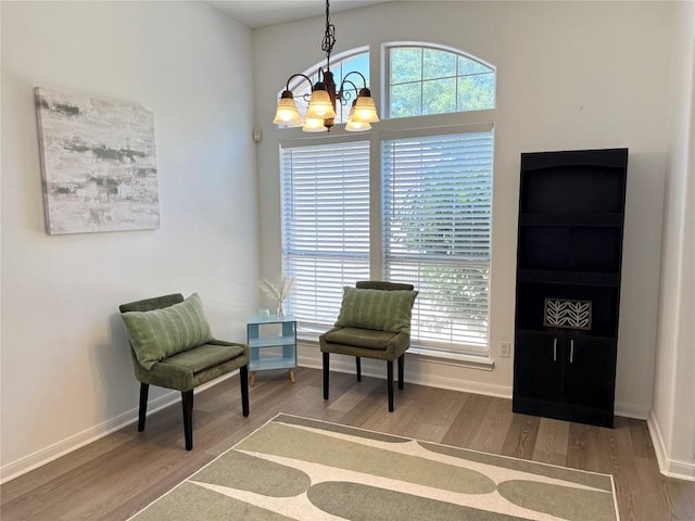 6419 Ira Ingram Dr, Austin, TX 78749 - sitting room with a chandelier, wood finished floors, and healthy amount of natural light