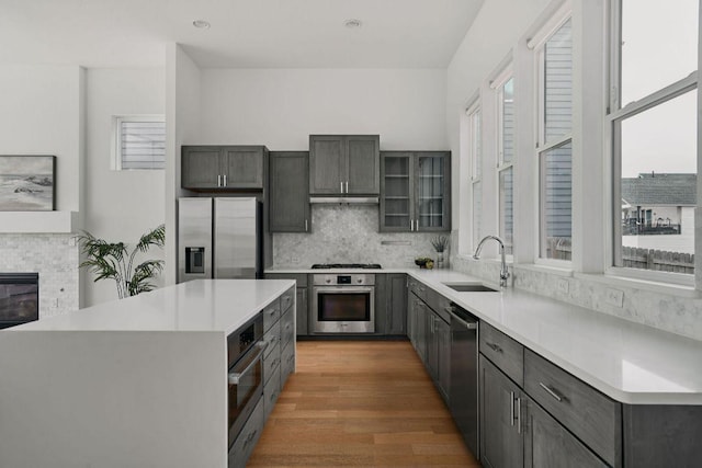 6116 Toscana Ave, Austin, TX 78724 - kitchen with stainless steel appliances, a sink, plenty of natural light, backsplash, and recessed lighting
