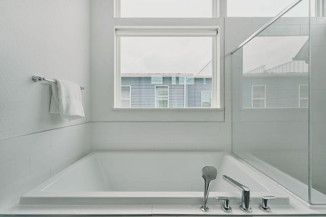 6116 Toscana Ave, Austin, TX 78724 - full bathroom featuring plenty of natural light and a garden tub